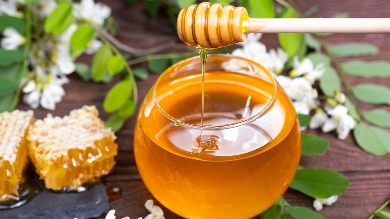 Glass jar filled with honey