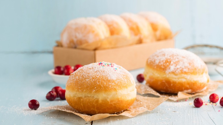 Cream-filled doughnuts with powdered sugar