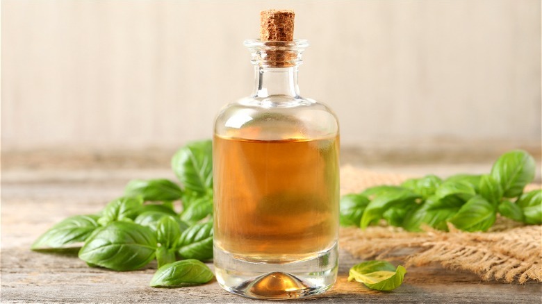 oil container with basil leaves