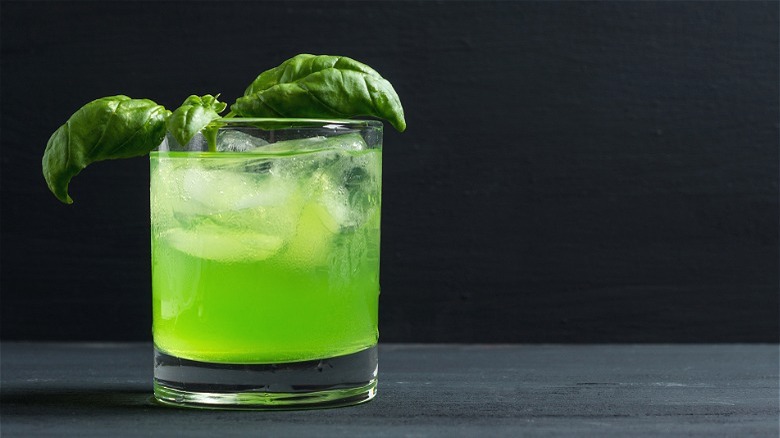 green cocktail with basil