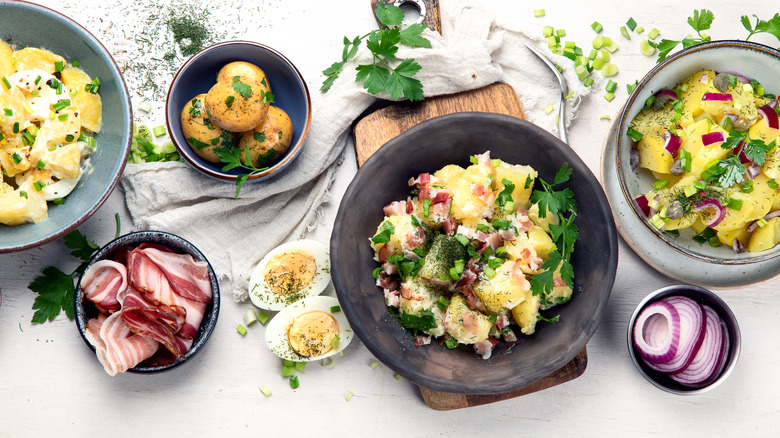 Bowls of different kinds of potato salad