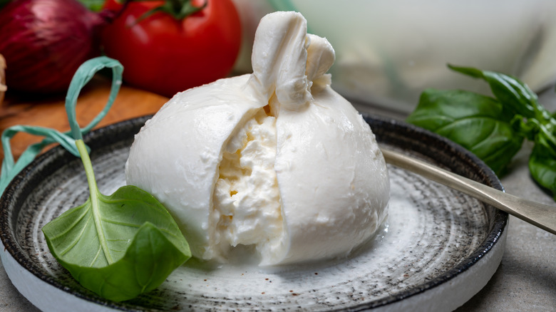 creamy ball of burrata on plate