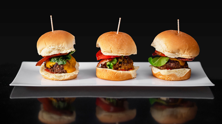 Cheeseburger sliders on dark background