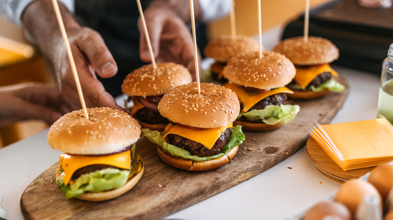 Cheeseburger sliders on cutting board