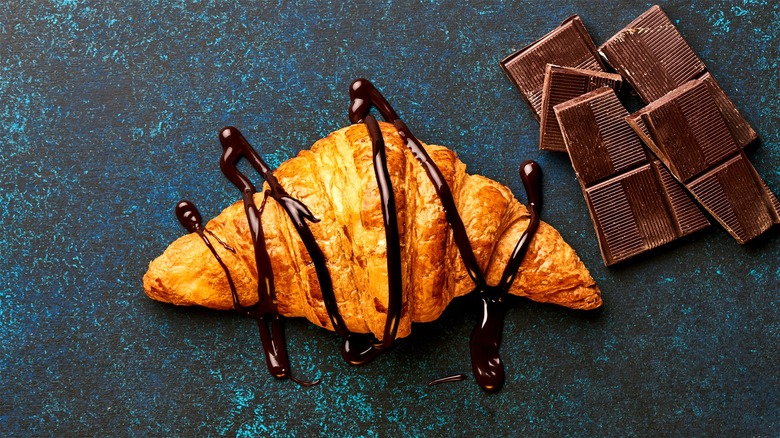 Chocoate-drizzled croissant and chocolate bar 