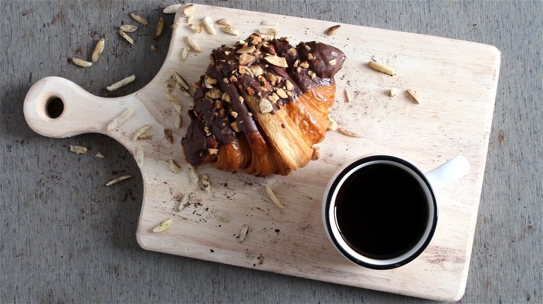 Croissant dipped in chocolate and almonds 