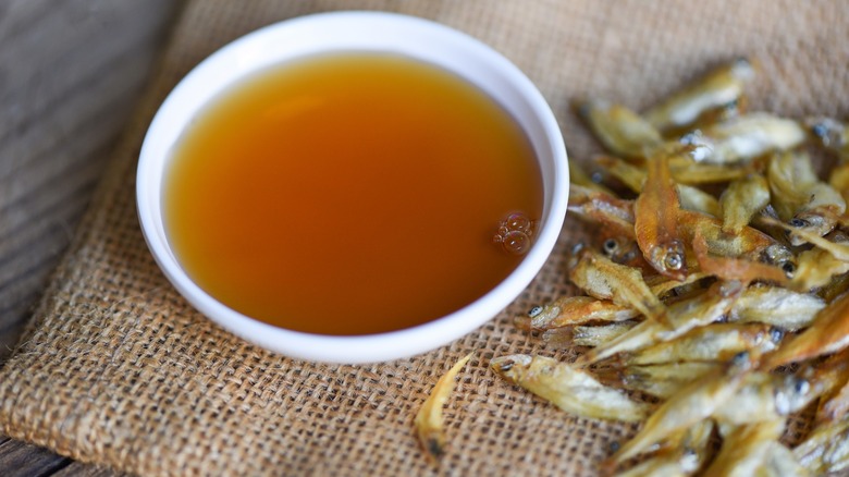 Fish sauce in a bowl with dried fish