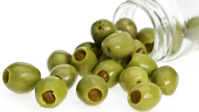 cocktail olives spilling out of jar