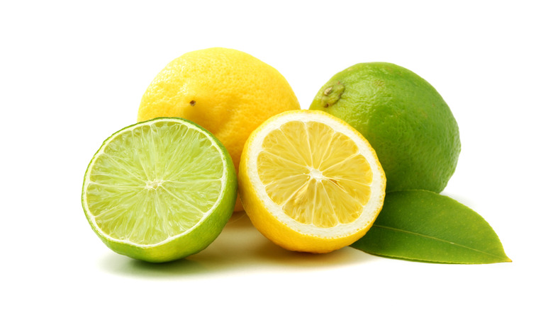 Lemon and lime on white background