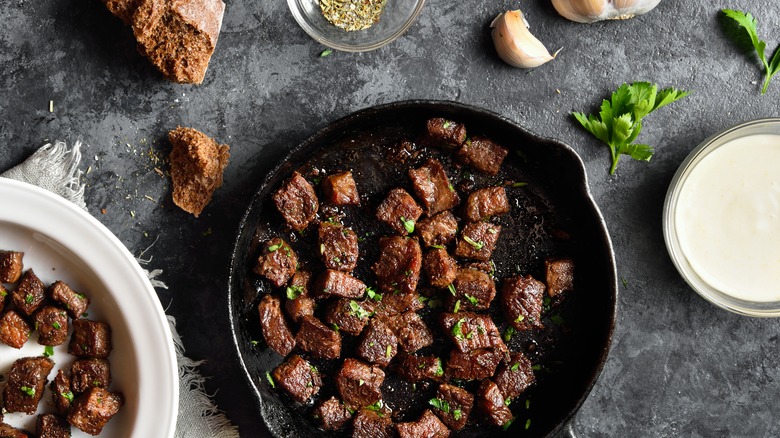 Browned steak in cast-iron skillet