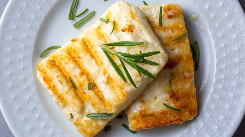 Grilled halloumi on white plate