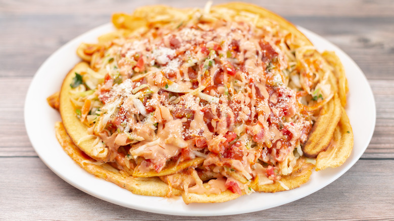 A plate of loaded plantain nachos