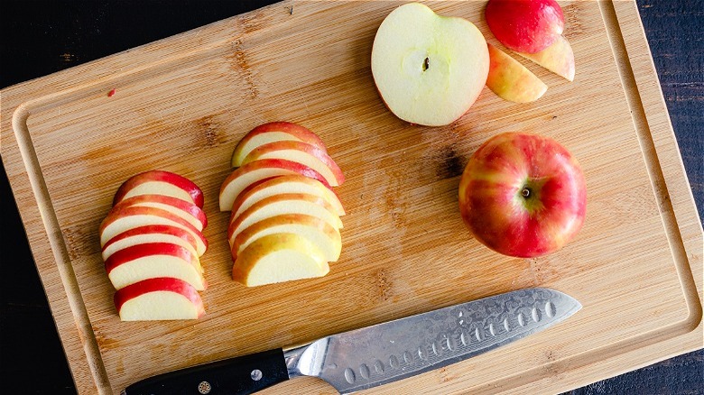 Sliced apples on cutting board