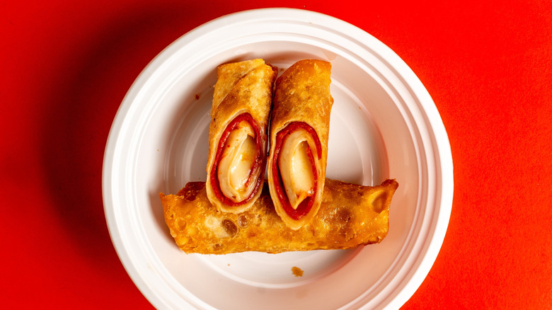 pizza egg rolls in disposable container