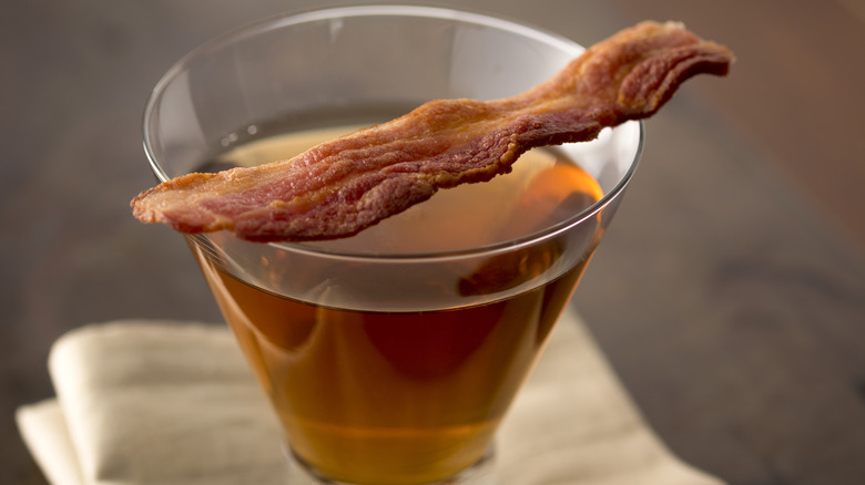 Bacon strip over bourbon shot