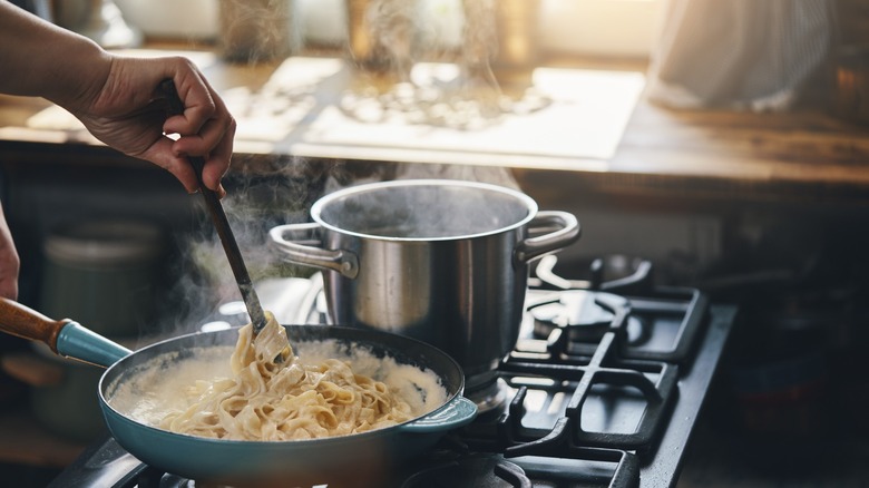 Fettucine alfredo being cooked