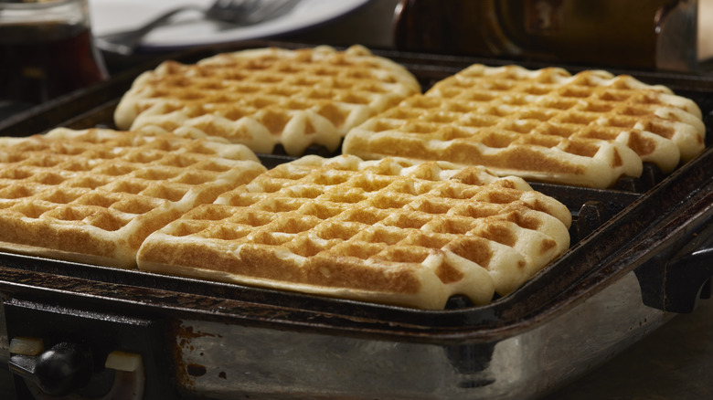 Row of waffles being cooked