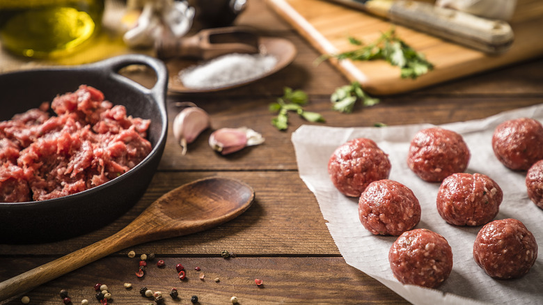 Raw meatballs and mix on a table