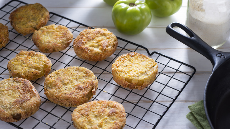 fried green tomatoes on a cooling rack