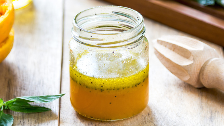 Glass jar of orange vinaigrette