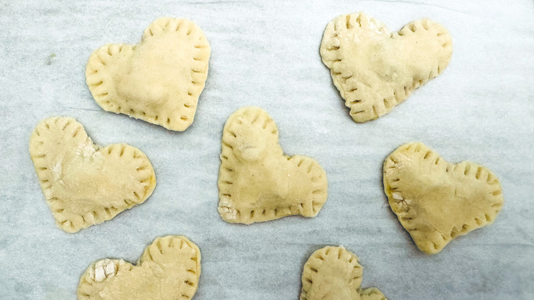 sealed pastry hearts on sheet