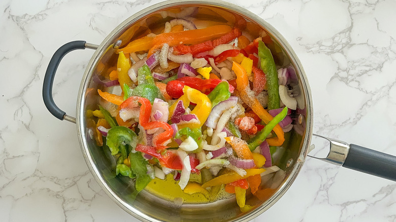 peppers and onions in pan