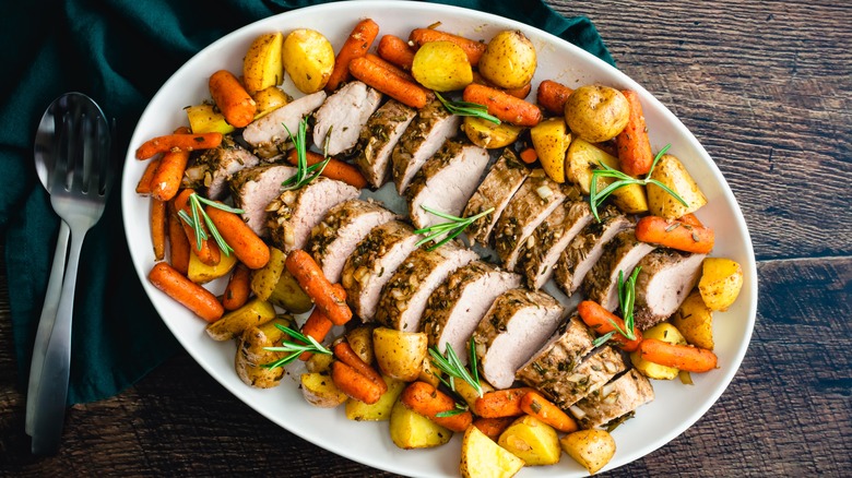 Sliced pork roast with roasted vegetables