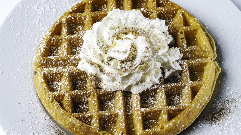 Waffle topped with whipped cream