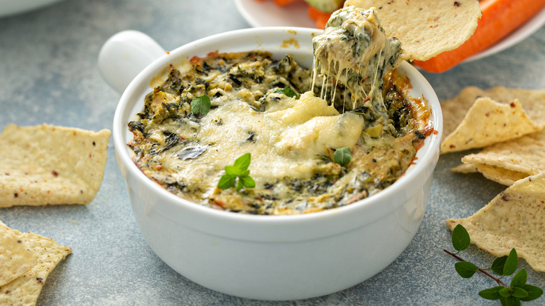 white bowl of spinach and artichoke dip