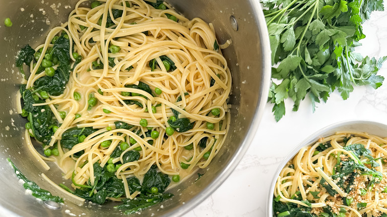 cheesy carbonara with peas and spinach in pot