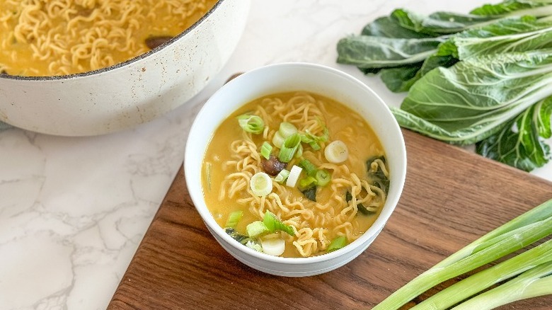 single serving of veggie coconut curry with scallions