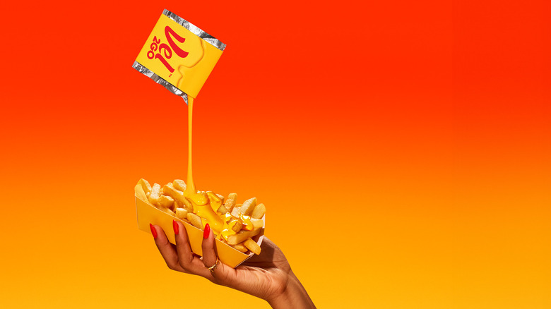 Velveeta's new Vel2go packed pouring Velveeta onto french fries