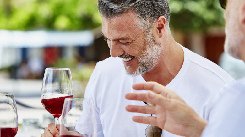 man drinking wine