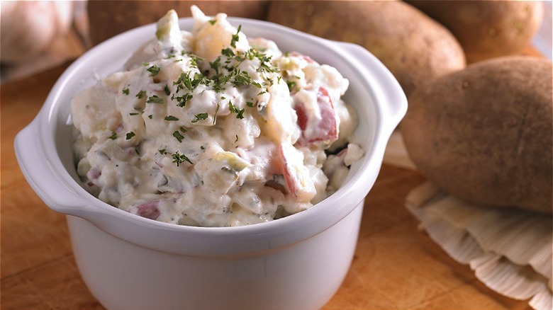 Potato salad in small white casserole