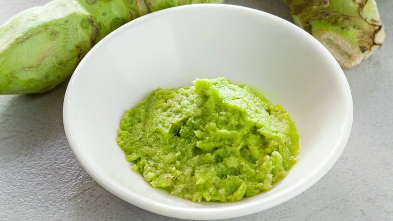 wasabi plant with grated wasabi in bowl