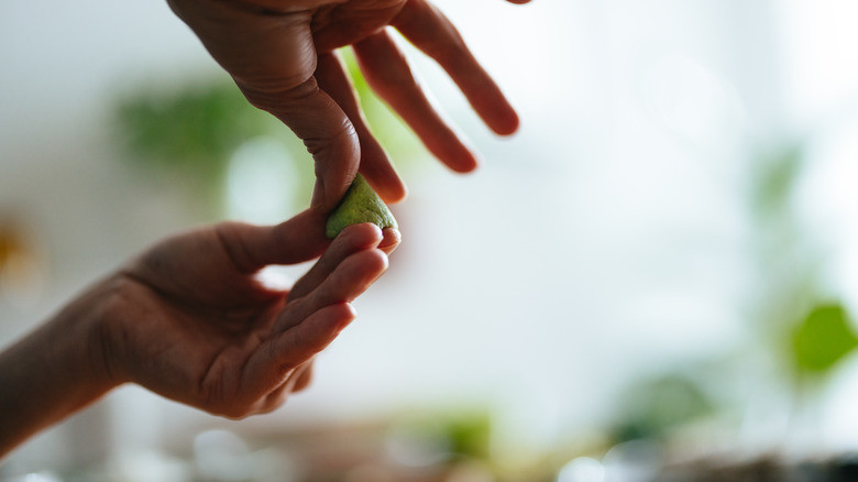 Woman molding wasabi paste