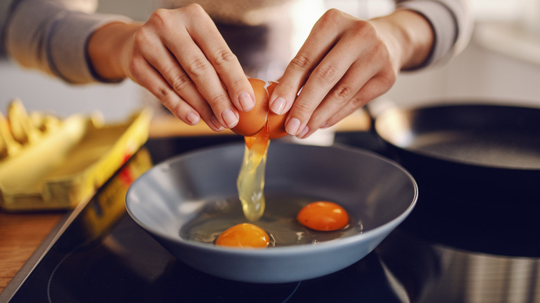 https://www.thedailymeal.com/img/gallery/water-basted-eggs-are-the-big-batch-solution-you-need/intro-1669994242.jpg