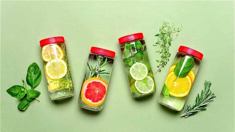 Bottles of water with citrus slices 