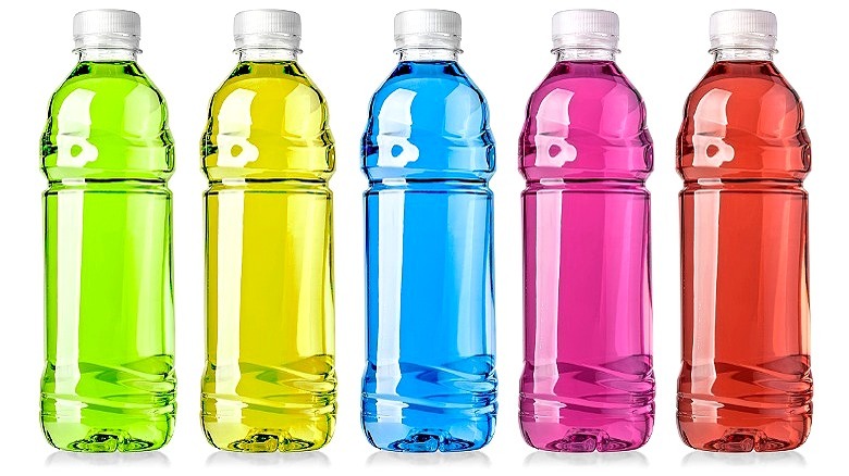 Clear bottles of colorful water 