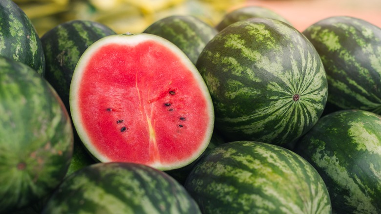 fresh whole and halved watermelons