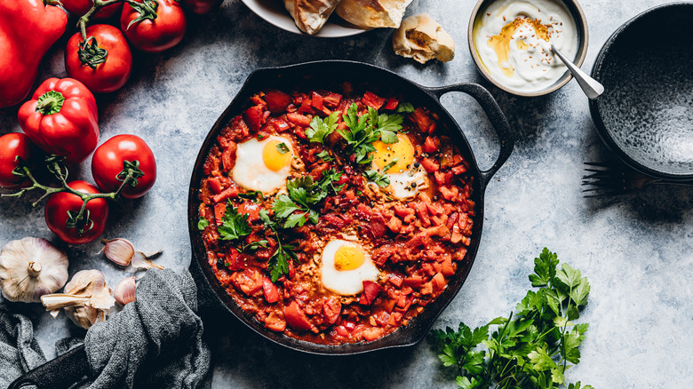 A top view of a cast iron skillet of shakshouka.