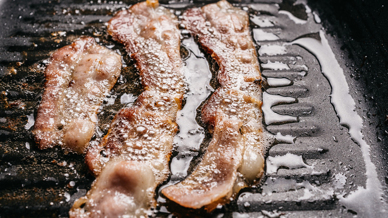 Bacon frying on electric grill