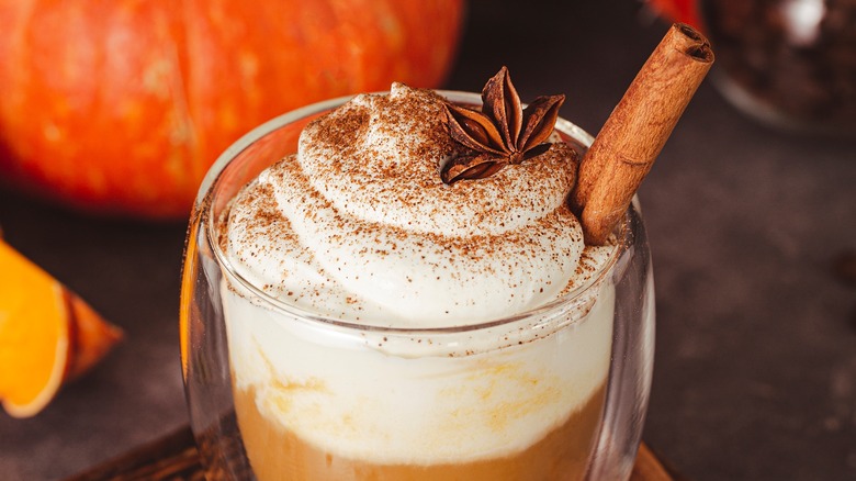 spiced latte with star anise and cinnamon stick glass tumbler