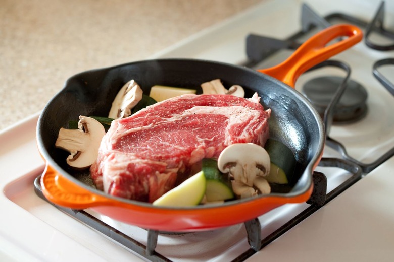 By putting very cold food into the pan