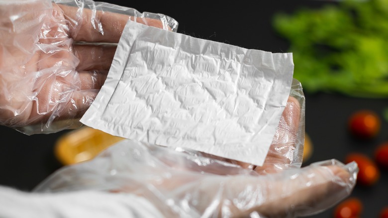 hands displaying meat pad