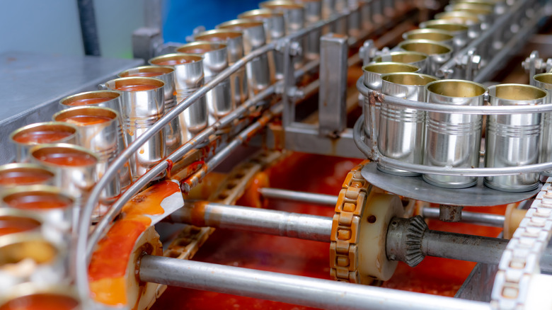 Cans being filled at a factory