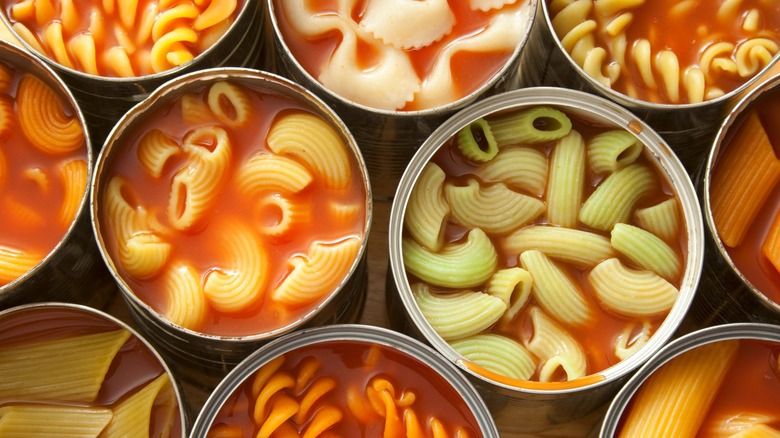 Open cans of pasta in sauce