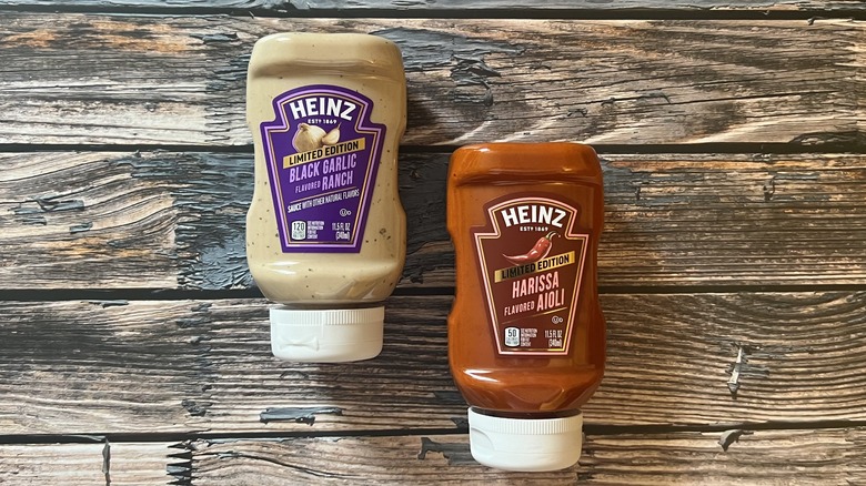  Black Garlic Ranch and Harissa Aioli bottles