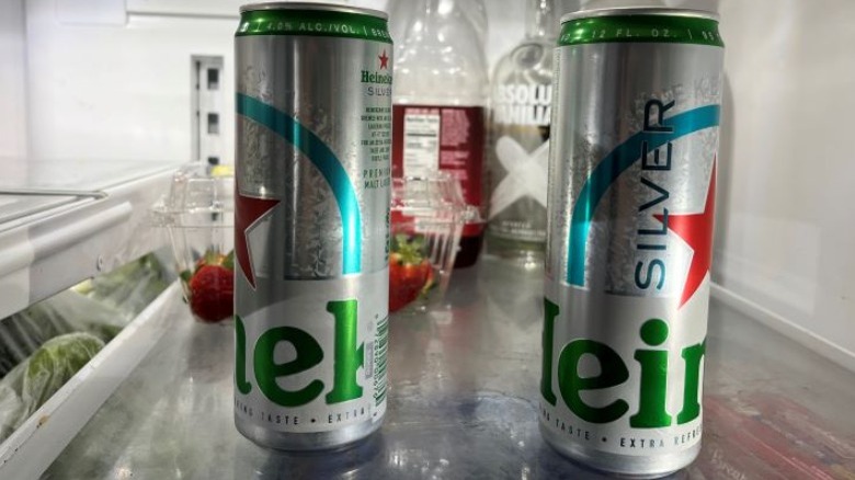 Two cans of Heineken Silver in fridge