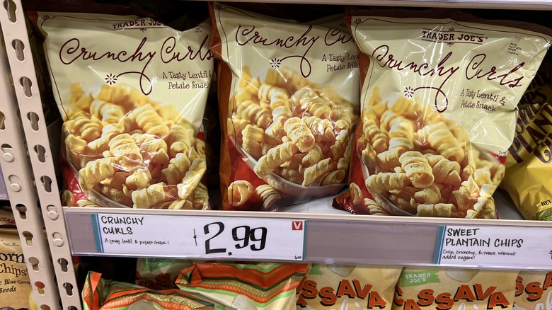 shelf with bags of Crunchy Curls